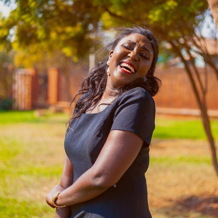 Ava Singh, Lead Design Curator at GladeFoamBeacon, reviewing corporate floral arrangements